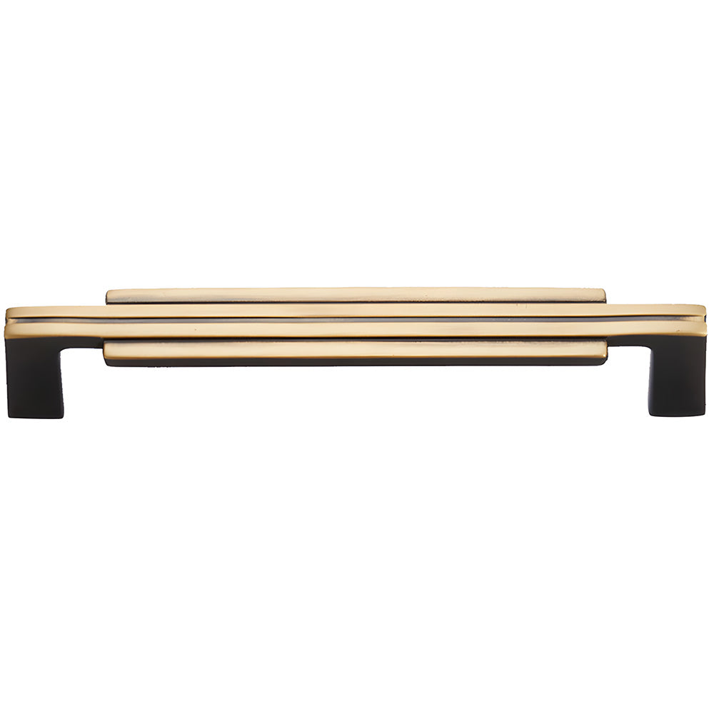 Art Deco brass cabinet pull and knob, shown from one angle on a clean neutral background