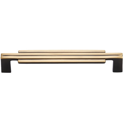 Art Deco brass cabinet pull and knob, shown from one angle on a clean neutral background