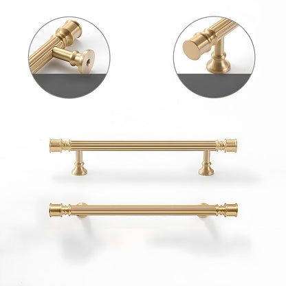 Gold art deco fluted brass pulls, knobs, and ring pulls, shown at close range showing the surface and mounting form