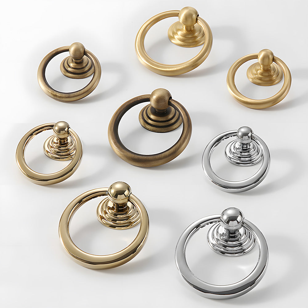 Art Deco fluted brass pulls, knobs, and ring pulls, shown from one angle as a color and finish lineup