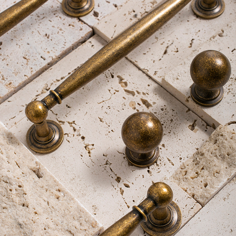 Brass round bar cabinet pull and round knob, displayed from the side as a color and finish lineup