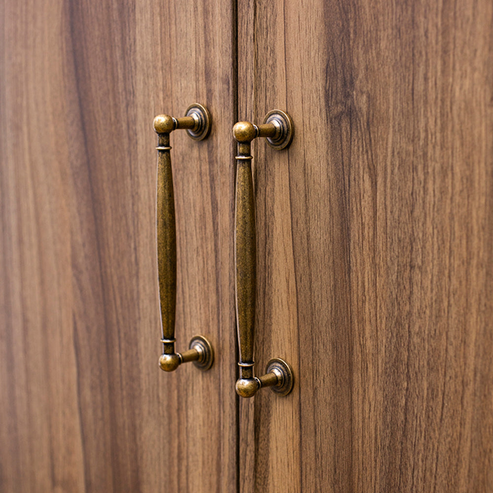 Bronze brass round bar cabinet pull and round knob, displayed from the side installed on cabinetry in context