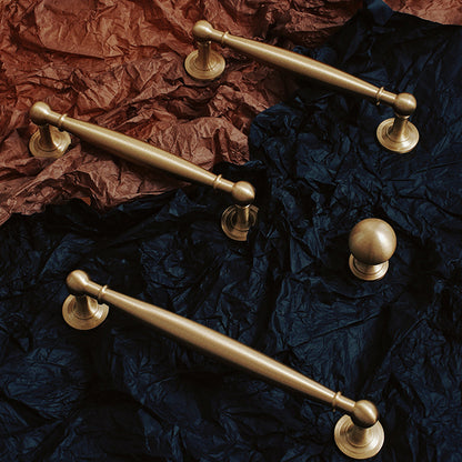 Brass round bar cabinet pull and round knob, presented for reference as a color and finish lineup