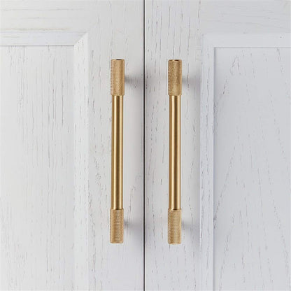 Knurled T-bar cabinet pull and round knob, shown clearly in an installed cabinet close-up