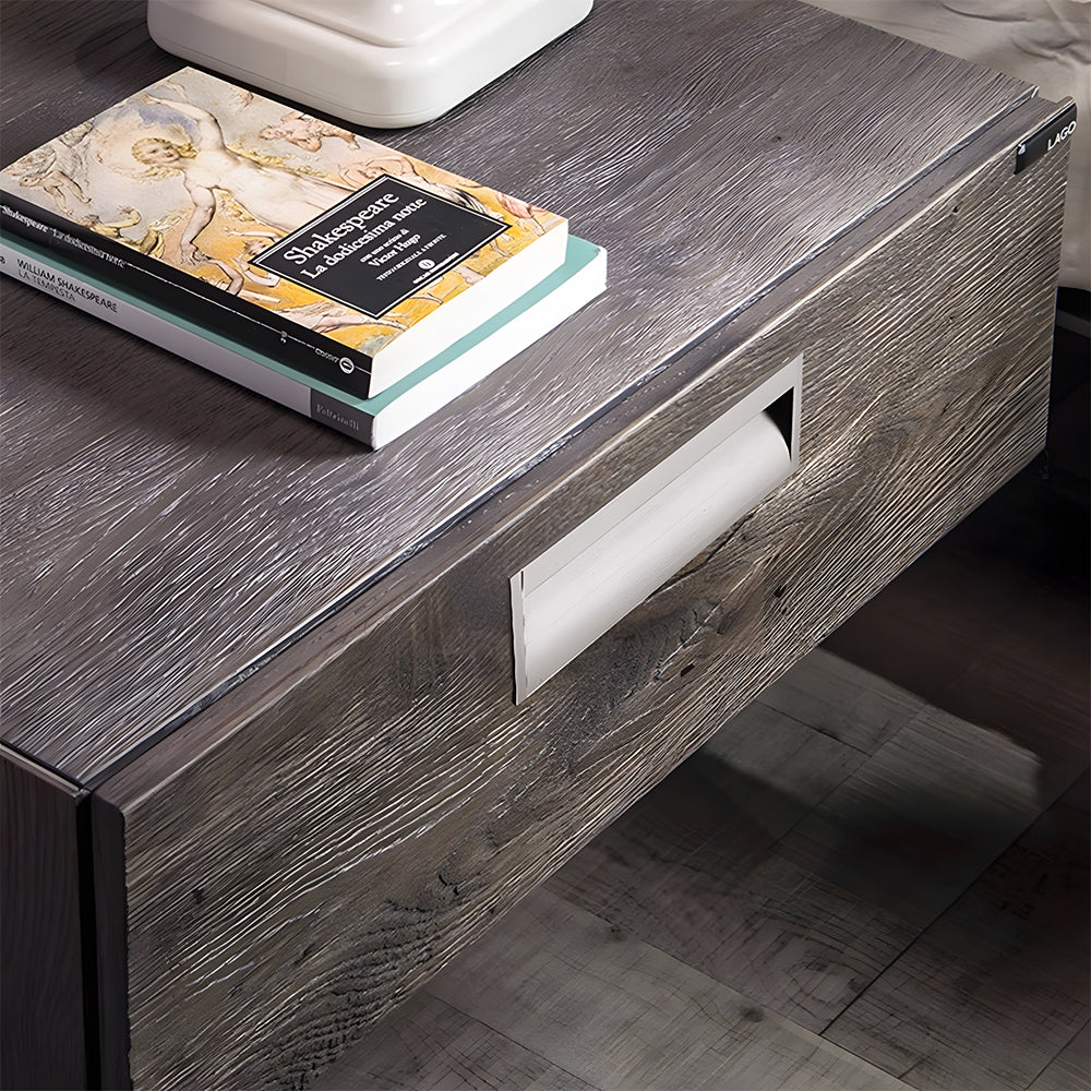 Silver aluminum recessed cabinet pull with 128 mm hole centers installed on a wood-grain drawer
