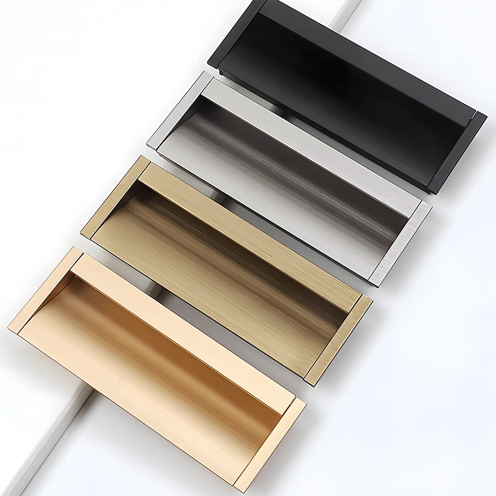 Recessed cabinet pulls in black, silver, bronze, and gold finishes staggered on white