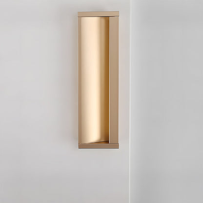 Gold aluminum recessed cabinet pull in a straight-on vertical view on a light cabinet door