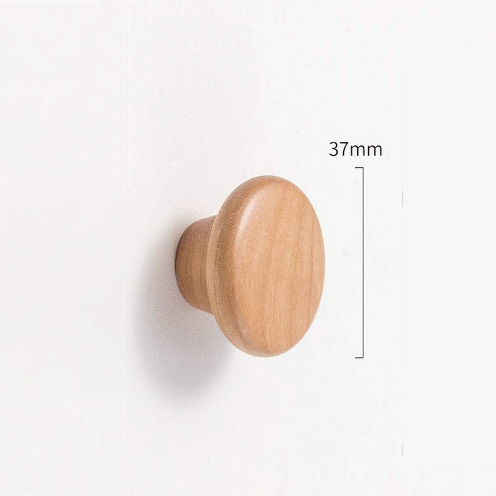 Curved solid wood cabinet pull with a matching round knob, dimension reference with the center-to-center spacing marked