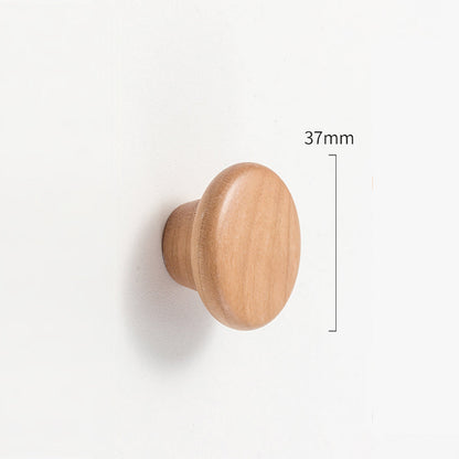 Curved solid wood cabinet pull with a matching round knob, dimension reference with the center-to-center spacing marked