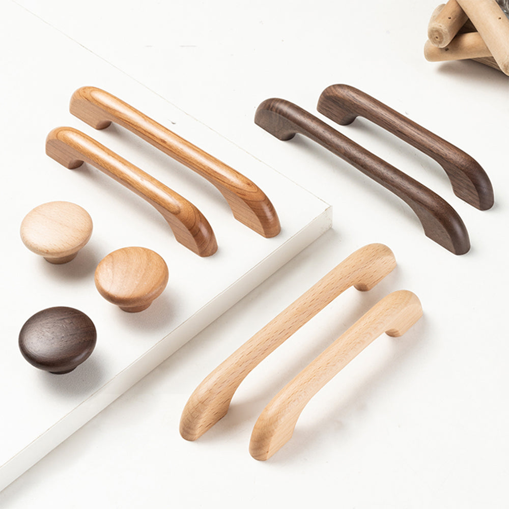 Curved wood cabinet pull and knob in beech with 128 mm centers, shown as a mixed lineup of related hardware pieces
