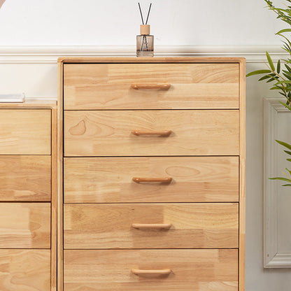 Curved solid wood cabinet pull with a matching round knob, installed horizontally on a drawer front in a close view