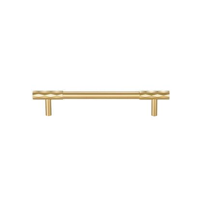 Faceted brass cabinet pull and round knob, shown at close range on a clean neutral background