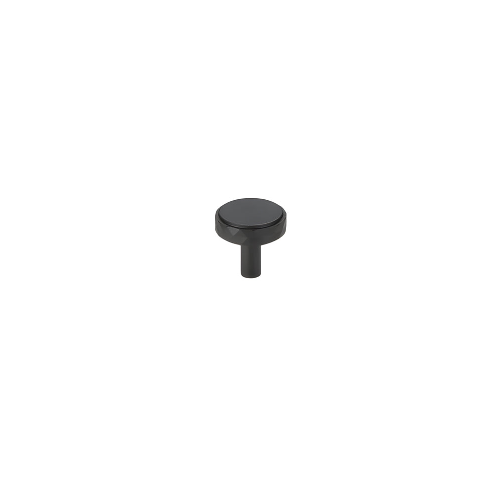 Black faceted brass cabinet pull and round knob, pictured in one view with its shape and finish visible