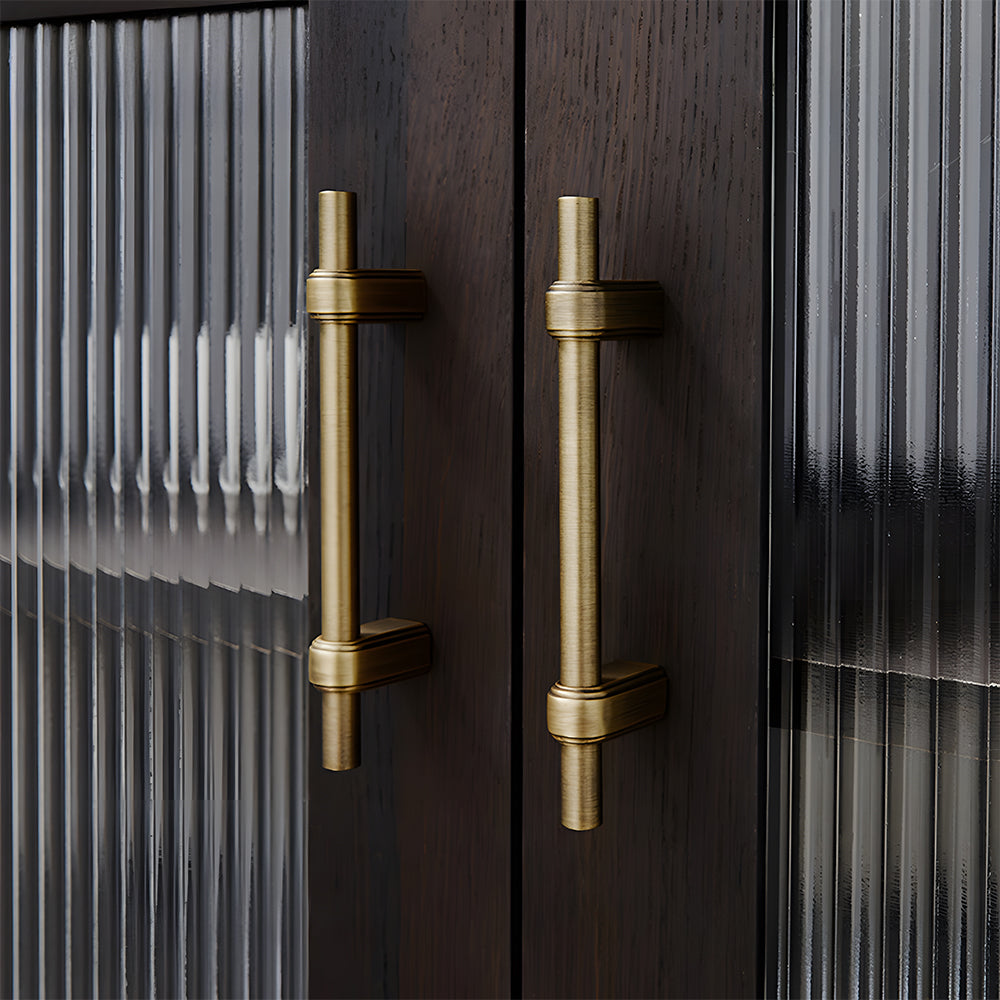 French brass round bar cabinet pull with block mounts, shown clearly in an installed cabinet close-up