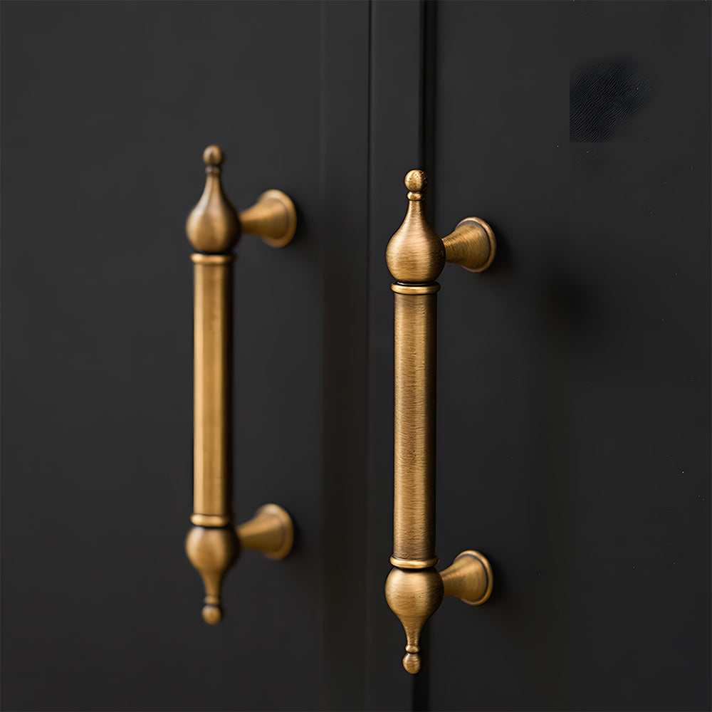 French retro turned brass cabinet pull and spindle knob, pictured in one view installed on cabinetry in context