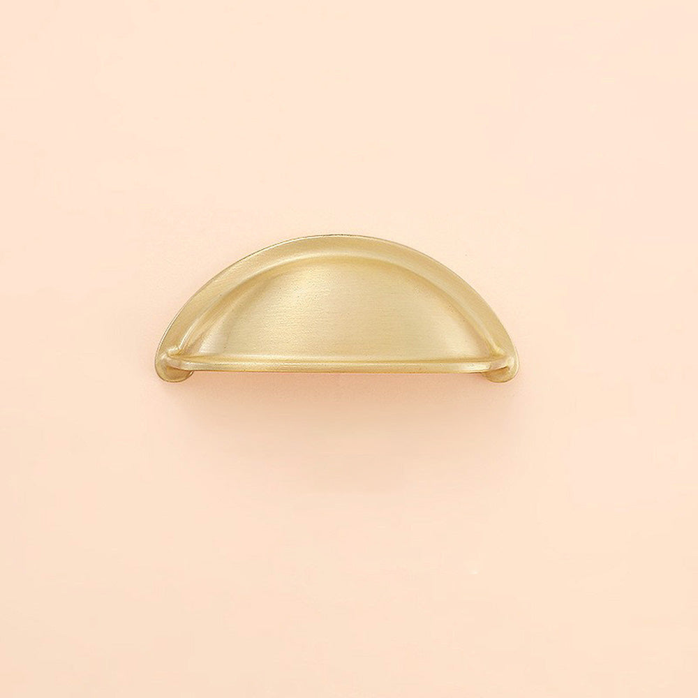 Gold half-round brass cabinet cup pull, pictured in one view on a clean neutral background