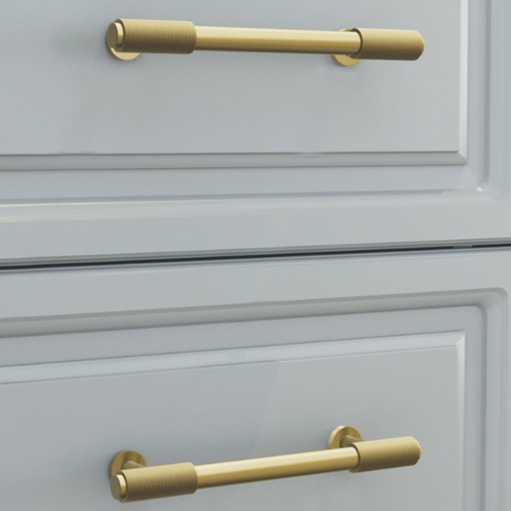 Knurled brass round bar cabinet pull, shown clearly installed on cabinetry in context