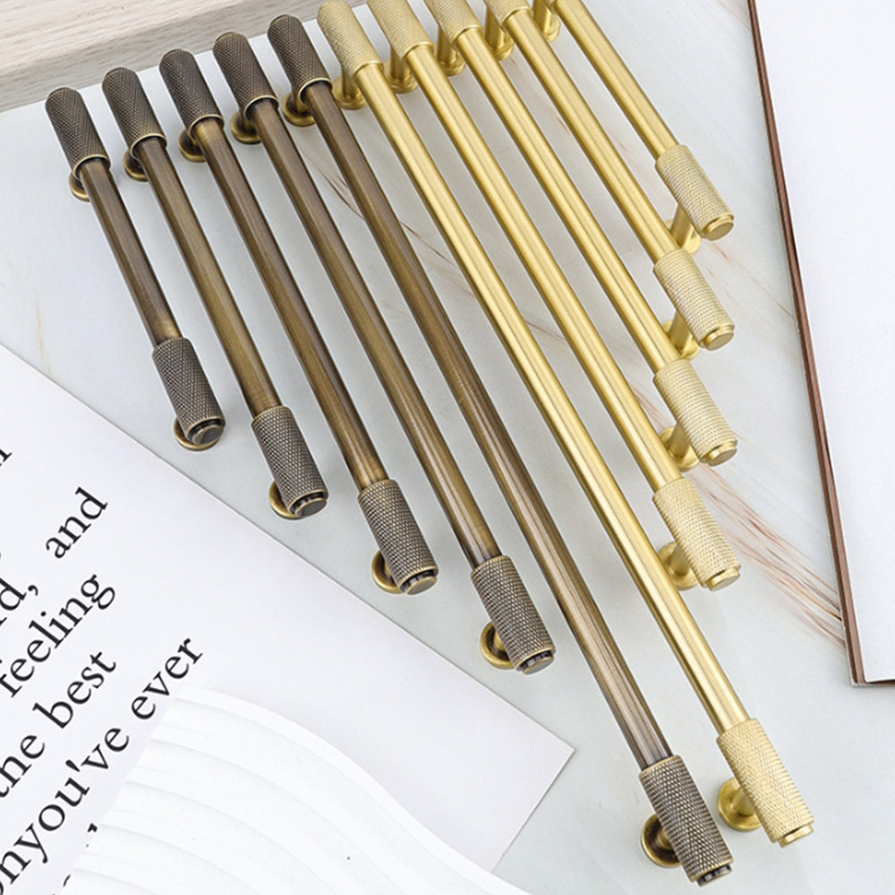 Knurled brass round bar cabinet pull, shown from one angle as a color and finish lineup