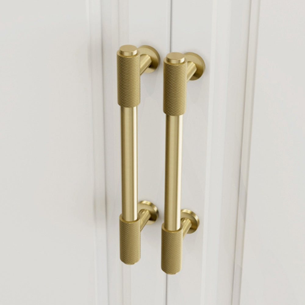 Knurled brass round bar cabinet pull, shown clearly in an installed cabinet close-up