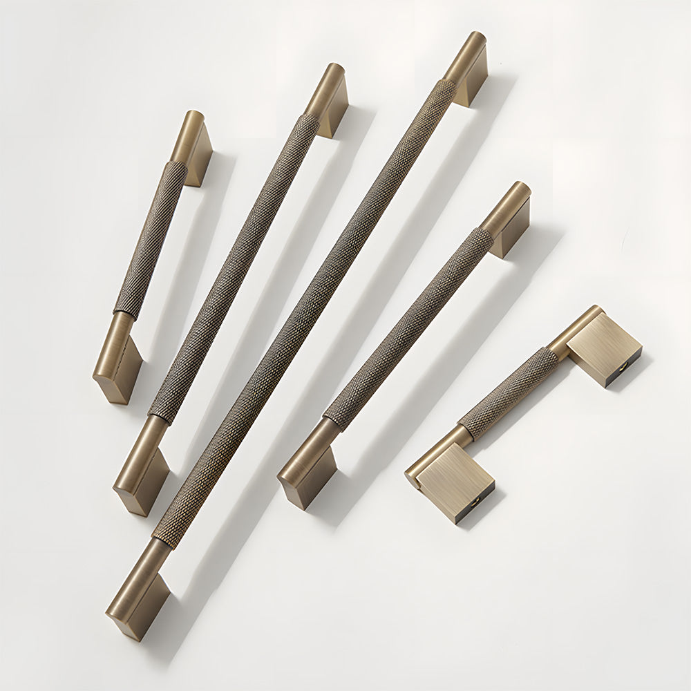 Knurled brass cabinet pull with rectangular mounts and knob, shown clearly with related hardware in one display