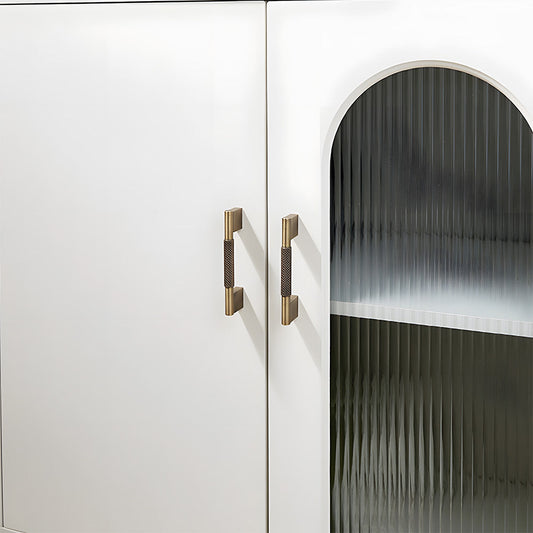 Knurled brass cabinet pull with rectangular mounts and knob, shown clearly installed on cabinetry in context