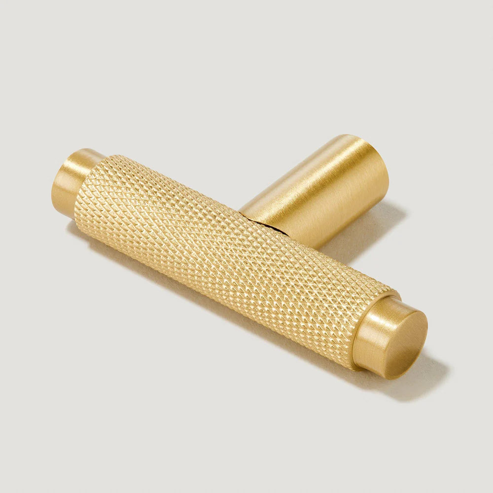 Gold knurled T-bar cabinet pull, shown clearly with its construction and finish visible