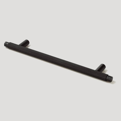 Knurled T-bar cabinet pull, shown in a focused view on a clean neutral background
