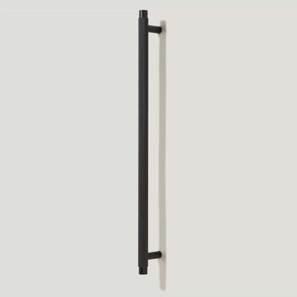 Black knurled T-bar cabinet pull, presented in another view on a clean neutral background