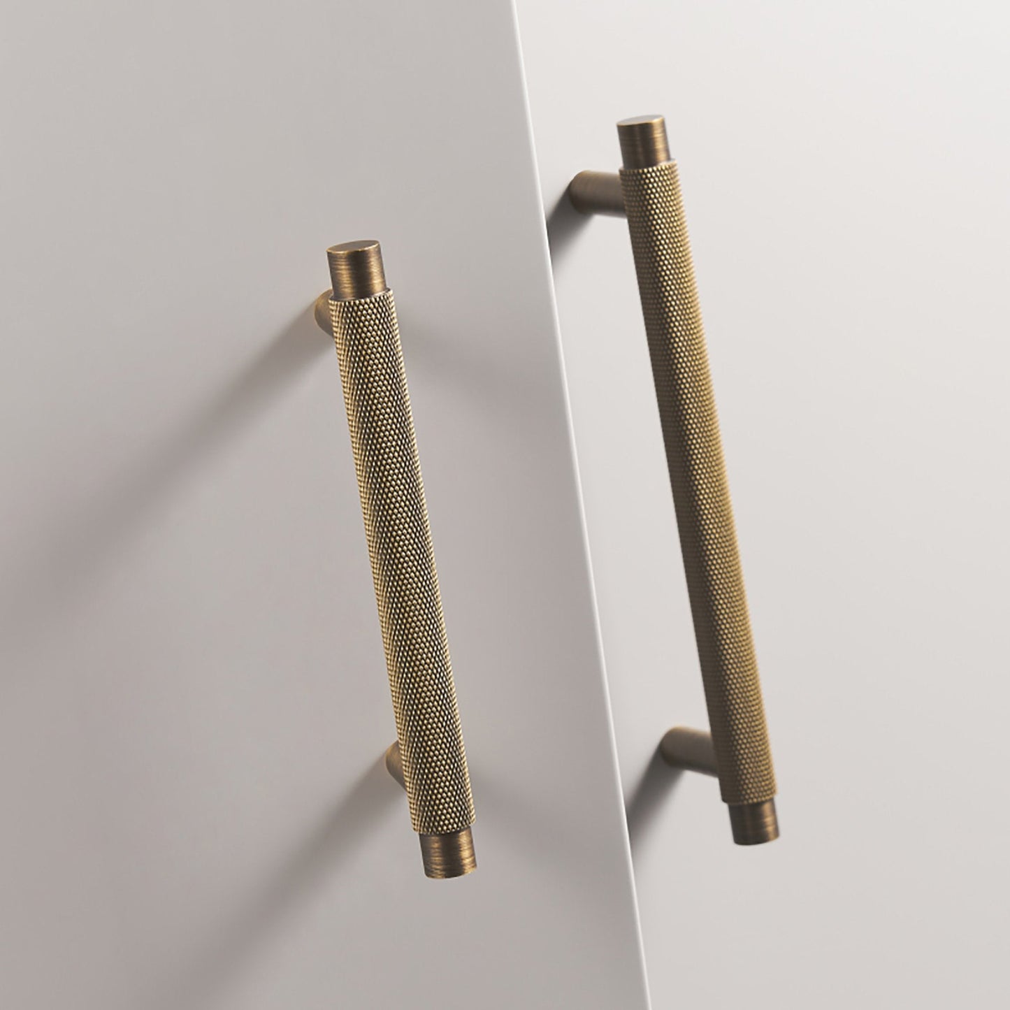 Antique bronze knurled T-bar cabinet pull, shown at close range in an installed cabinet close-up