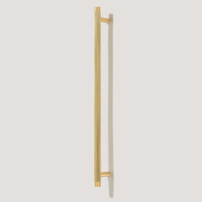 Gold knurled T-bar cabinet pull, presented for reference on a clean neutral background