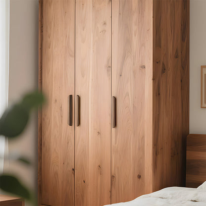 Low-profile walnut cabinet pull in black walnut with 192 mm centers, installed vertically on paired wardrobe doors