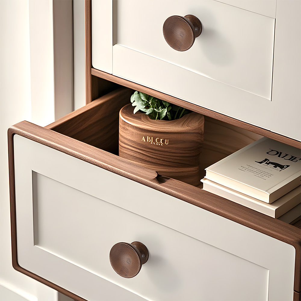 Low-profile walnut cabinet pull as a black walnut single-hole version, installed horizontally on a drawer front