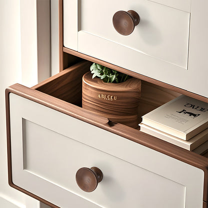 Low-profile walnut cabinet pull as a black walnut single-hole version, installed horizontally on a drawer front