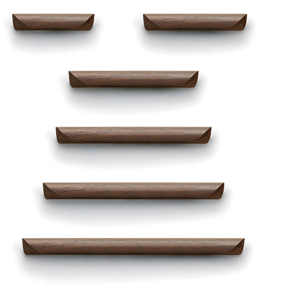Minimalist walnut wood cabinet pull with a low curved profile, shown in a straight lineup comparing available lengths