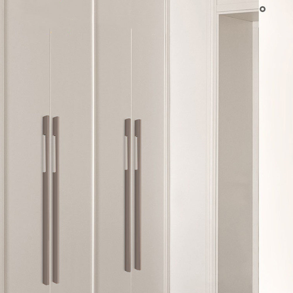 Slim rectangular aluminum cabinet pull, displayed from the side installed on cabinetry in context