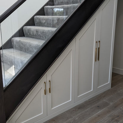 Slim rectangular aluminum cabinet pull, shown in a focused view installed on cabinetry in context