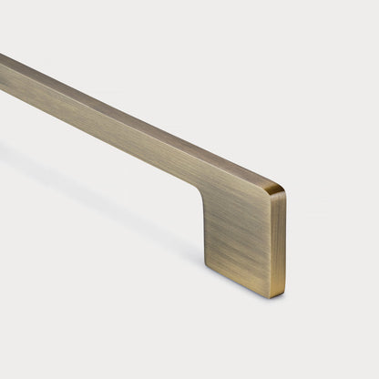 Slim rectangular aluminum cabinet pull, shown from one angle with its construction and finish visible