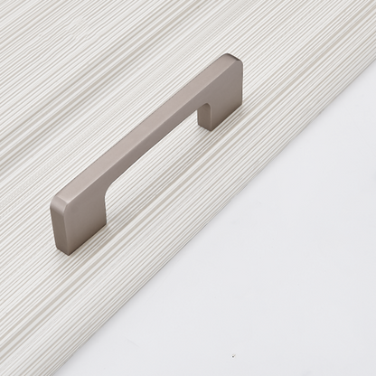 Antique nickel slim rectangular aluminum cabinet pull, shown at close range on a clean neutral background