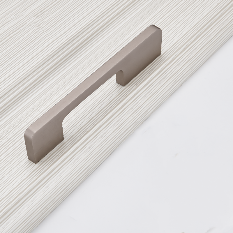 Antique nickel slim rectangular aluminum cabinet pull, shown from one angle on a clean neutral background