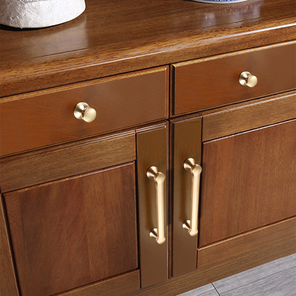 Traditional cabinet pull with flared mounts and knob, presented for reference installed on cabinetry in context