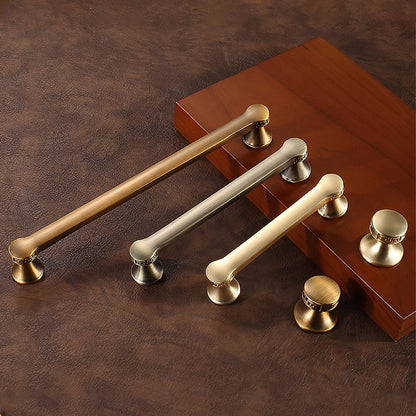 Traditional cabinet pull with flared mounts and knob, pictured in one view as a color and finish lineup