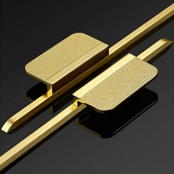 Long zinc cabinet pull with rectangular center plate, shown from one angle as a color and finish lineup