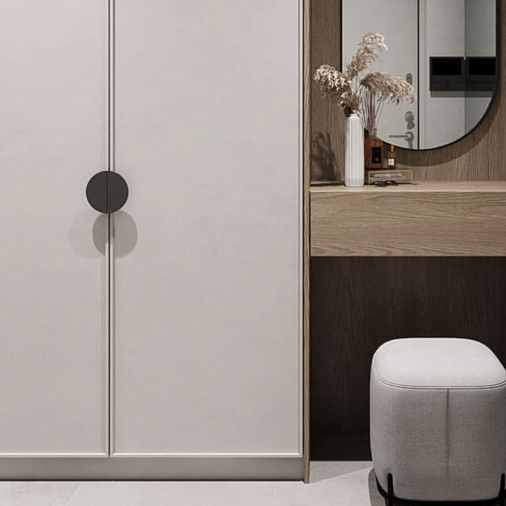 Half-moon cabinet edge pull, pictured in one view installed on cabinetry in context