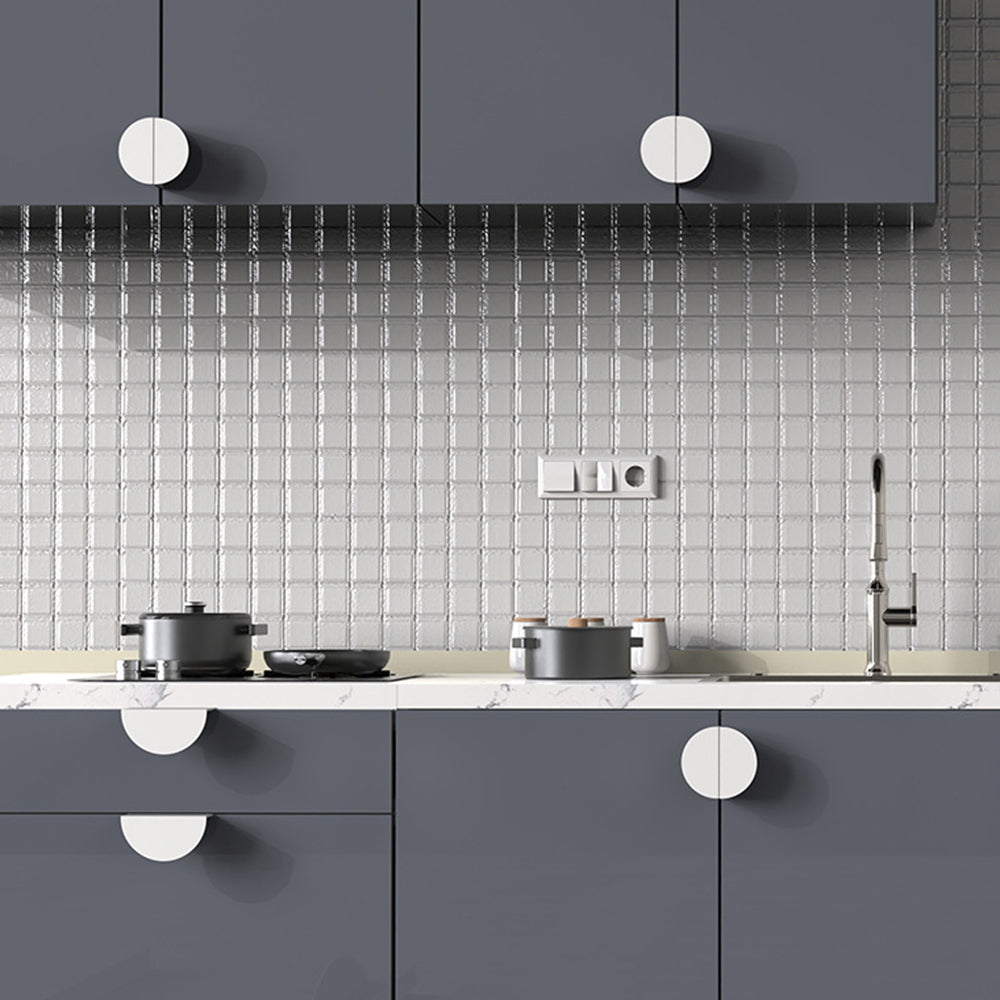 Half-moon cabinet edge pull, displayed from the side installed on cabinetry in context