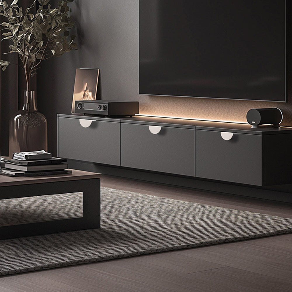 Half-moon cabinet edge pull, shown in a focused view installed on cabinetry in context