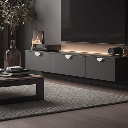Half-moon cabinet edge pull, shown in a focused view installed on cabinetry in context