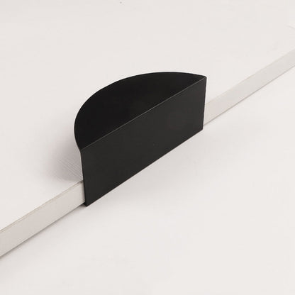 Half-moon cabinet edge pull, shown at close range on a clean neutral background with key hardware details visible