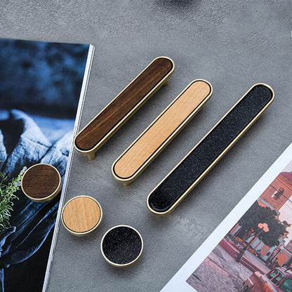 Natural wood inlay cabinet pull with a rounded metal frame, grouped on a light surface to compare lengths and profiles
