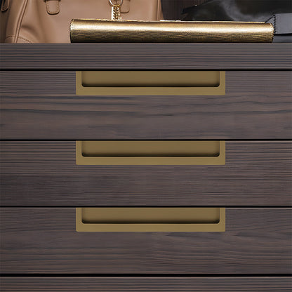Bronze concealed slotted cabinet pull, shown clearly installed on cabinetry in context