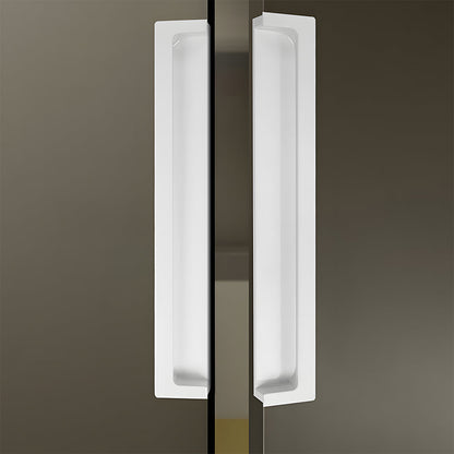 White concealed slotted cabinet pull, pictured in one view in an installed cabinet close-up